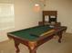 Game room featuring a classic pool table with window and cabinet at 10762 Galant Fox Ct, Indianapolis, IN 46234