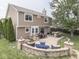 Well-maintained backyard with patio, outdoor seating, and lush landscaping at 1228 Easton Point Dr, Greenwood, IN 46142