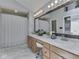 Bright bathroom with double sinks, large mirrors, and ample cabinet storage at 1228 Easton Point Dr, Greenwood, IN 46142