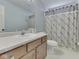 Functional bathroom with shower-tub combo and modern vanity at 1228 Easton Point Dr, Greenwood, IN 46142