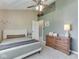 Tranquil bedroom with a ceiling fan and hardwood dresser at 1228 Easton Point Dr, Greenwood, IN 46142