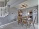 Comfortable dining room with wood table and chairs, featuring a modern light fixture at 1228 Easton Point Dr, Greenwood, IN 46142