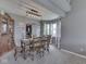 Cozy dining room with a wooden table, comfortable chairs, and a modern light fixture at 1228 Easton Point Dr, Greenwood, IN 46142