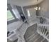 Bright and spacious foyer with staircase, chandelier, and view of the living area at 1228 Easton Point Dr, Greenwood, IN 46142