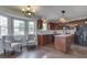 Charming kitchen featuring hardwood floors, updated appliances, central island, and bay window breakfast nook at 1228 Easton Point Dr, Greenwood, IN 46142