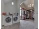 Convenient laundry room adjoining a large, organized walk-in closet at 1228 Easton Point Dr, Greenwood, IN 46142