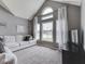 Inviting living room with large windows, a vaulted ceiling, and comfortable seating at 1228 Easton Point Dr, Greenwood, IN 46142