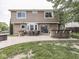 Spacious backyard patio featuring a built-in bar, dining area, and ample seating at 1228 Easton Point Dr, Greenwood, IN 46142