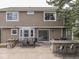 Backyard patio with a built-in grill, dining area, and outdoor seating at 1228 Easton Point Dr, Greenwood, IN 46142