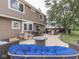 Backyard patio with a dining set, built-in grill, and cozy outdoor seating area at 1228 Easton Point Dr, Greenwood, IN 46142