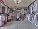 Spacious walk-in closet offering extensive shelving and hanging space for organized storage at 1228 Easton Point Dr, Greenwood, IN 46142