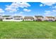 The vast backyard and neighborhood homes create a perfect setting for outdoor activities and community living at 12404 Rose Haven Dr, Indianapolis, IN 46235