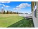 A large backyard provides a peaceful view from the deck and is perfect for a variety of outdoor activities at 12404 Rose Haven Dr, Indianapolis, IN 46235