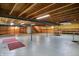 Unfinished basement with exposed ceiling, support beams, cement floor, and half painted walls at 12404 Rose Haven Dr, Indianapolis, IN 46235