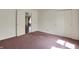 A modest-sized bedroom with white walls, mauve carpet, and double-door closet at 12404 Rose Haven Dr, Indianapolis, IN 46235