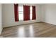 Bedroom with natural light, wood floors, and neutral walls at 12404 Rose Haven Dr, Indianapolis, IN 46235