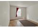 Light-filled bedroom with wood floor, window, and neutral walls at 12404 Rose Haven Dr, Indianapolis, IN 46235