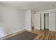 Light-filled bedroom with hardwood floors, and closet with folding doors at 12404 Rose Haven Dr, Indianapolis, IN 46235
