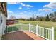A lovely deck provides an elevated outdoor space with serene views of the expansive, grassy backyard at 12404 Rose Haven Dr, Indianapolis, IN 46235