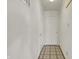 A hallway with neutral paint, neutral flooring, and doors at 12404 Rose Haven Dr, Indianapolis, IN 46235