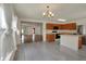 Open concept kitchen and dining area with modern appliances and hardwood floors at 12404 Rose Haven Dr, Indianapolis, IN 46235