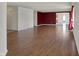 Bright living room with hardwood floors and open layout leading to the dining area and kitchen at 12404 Rose Haven Dr, Indianapolis, IN 46235