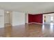 Expansive living room with hardwood floors and a seamless transition to the adjacent dining area at 12404 Rose Haven Dr, Indianapolis, IN 46235