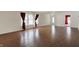 Open living room with hardwood floors, bright windows, and freshly painted neutral walls at 12404 Rose Haven Dr, Indianapolis, IN 46235