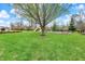 Community playground with slides, swings, and mature trees, ideal for outdoor fun and relaxation at 12404 Rose Haven Dr, Indianapolis, IN 46235