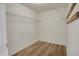Walk-in closet featuring light-colored wood floors and wire shelving at 12404 Rose Haven Dr, Indianapolis, IN 46235