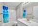Well-lit bathroom with a tub, toilet, and vanity with a mirror and sink at 12570 Timber Creek Dr # 7, Carmel, IN 46032