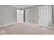 Spacious carpeted bedroom with two closets and ample natural light at 12570 Timber Creek Dr # 7, Carmel, IN 46032