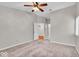 Spacious bedroom with neutral carpet, ceiling fan, and ample natural light at 12570 Timber Creek Dr # 7, Carmel, IN 46032