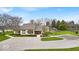 Exterior view of clubhouse surrounded by mature trees and landscaping at 12570 Timber Creek Dr # 7, Carmel, IN 46032