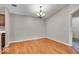 Bright dining area featuring wood floors and elegant chandelier at 12570 Timber Creek Dr # 7, Carmel, IN 46032