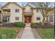 Attractive condo complex with landscaped entrance and bright, red door at 12570 Timber Creek Dr # 7, Carmel, IN 46032
