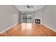 Hardwood floored living room with a fireplace, sliding glass doors, and plenty of light at 12570 Timber Creek Dr # 7, Carmel, IN 46032