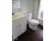Cozy bathroom features white tile, a modern vanity, and wood-look flooring for a clean and updated aesthetic at 1302 Lindley Ave, Indianapolis, IN 46241