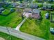 Aerial view of a landscaped property with lush green lawns and a large tree at 1325 Fordice Rd, Lebanon, IN 46052