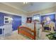 Charming bedroom featuring an accent wall and a lovely four-poster bed at 1325 Fordice Rd, Lebanon, IN 46052