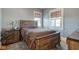 Neutral bedroom with warm wood furnishings and patterned curtains at 1325 Fordice Rd, Lebanon, IN 46052