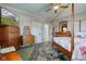 Charming bedroom with four poster bed, ceiling fan, and beautiful rug at 1325 Fordice Rd, Lebanon, IN 46052