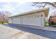 Spacious three-car garage with a paved driveway and side yard at 1325 Fordice Rd, Lebanon, IN 46052