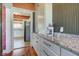 Kitchen area with abundant cabinets and granite countertops, flowing into adjacent living area at 1325 Fordice Rd, Lebanon, IN 46052