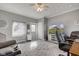 Comfortable living room with gray walls, a large area rug, a ceiling fan, and TV at 1325 Fordice Rd, Lebanon, IN 46052