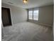 Spacious bedroom featuring plush carpet and natural light at 1404 Alonzo Pl, Indianapolis, IN 46217