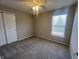 Cozy bedroom offers natural light from the window at 1404 Alonzo Pl, Indianapolis, IN 46217