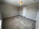 Inviting bedroom with neutral walls and soft carpeting at 1404 Alonzo Pl, Indianapolis, IN 46217