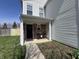 Charming front porch with a cozy seating area, perfect for enjoying the outdoors at 1404 Alonzo Pl, Indianapolis, IN 46217