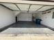 Spacious garage features a gray floor, door to interior, and water heater at 1404 Alonzo Pl, Indianapolis, IN 46217